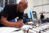 Engineer,Planning,Project,With,Cnc,Machinery,In,Background